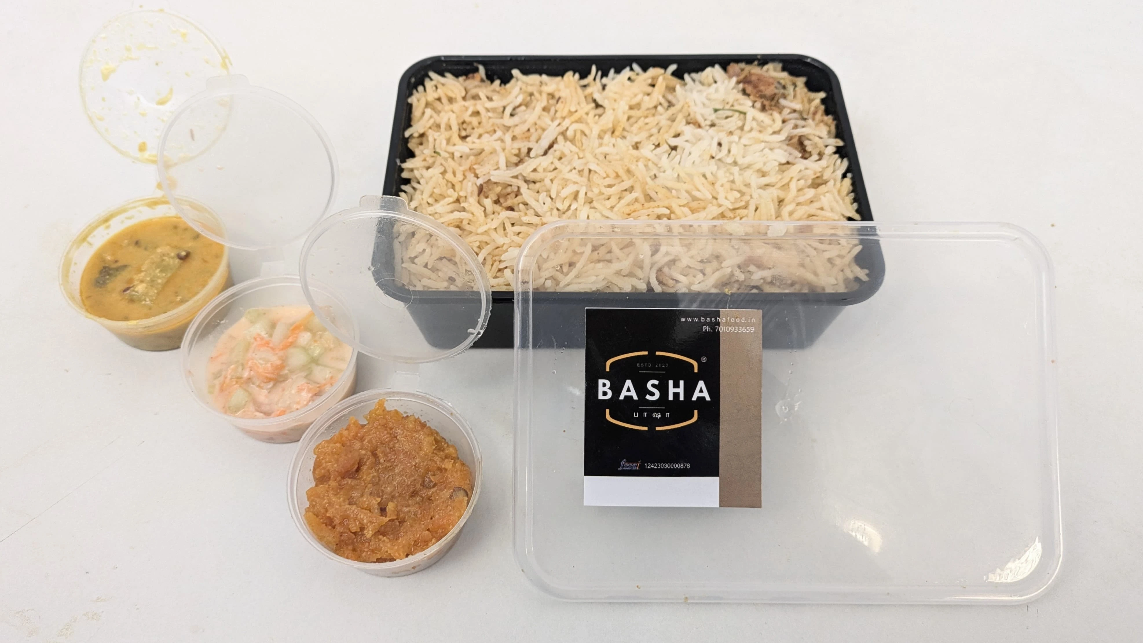 A Combo pack of Hyderabad Chicken Biriyani with various side dishes